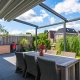 Pergola with folding canvas roof opening out